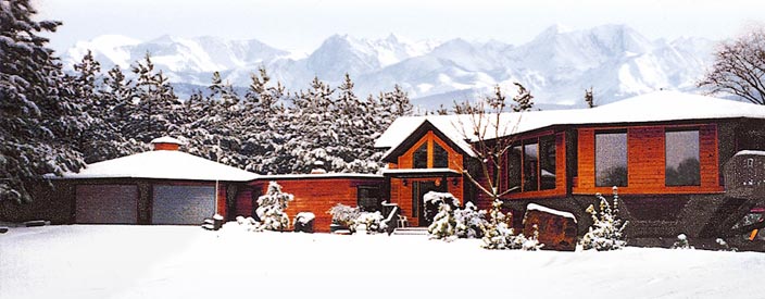 This mountain home provides fantastic views with an elevated living area featuring floor-to-ceiling windows.