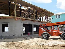 Rebuilding after Hurricane Sandy with concrete foundation with flood vents.