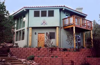 Southwestern Stucco Topsider Home unique two-story Southwest home with stucco and lodge pole pine supports