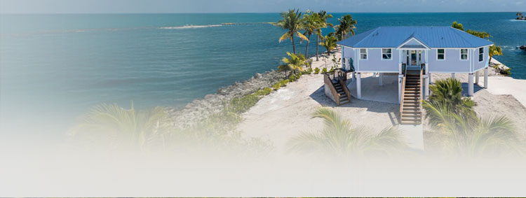Tropical waterfront home on sandy beach with dock