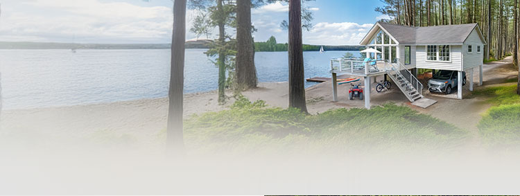 Lakefront custom home with modern design and surrounding trees