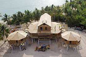 This magnificent luxury home, built in a remote location on North Andros, Bahamas, is shown during construction.