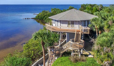 Topsider coastal Florida home elevated on a pedestal foundation