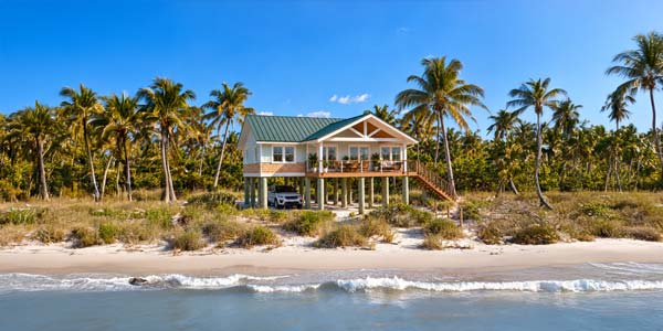 One-story elevated Topsider home on a wooded waterfront site