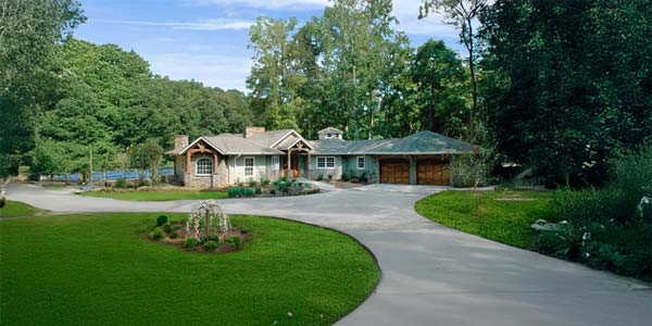 Signature Design Topsider ranch-style home in a wooded residential setting
