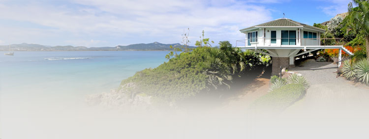 Hawaiian Pedestal Home with Pacific Ocean Views | Seismic-Resistant Design Pedestal home on a Hawaiian mountainside with seismic resistance and sweeping Pacific Ocean views.