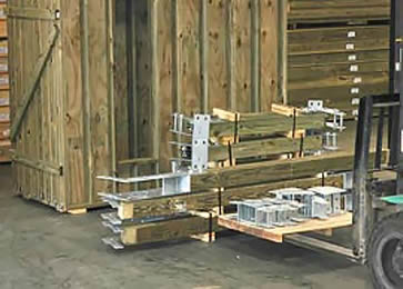 Prepackaged Post & Beam Components | Ready for Shipment to the Virgin Islands Topsider Homes prepackaged post and beam building components with galvanized steel couplings staged and ready for shipment to the Virgin Islands