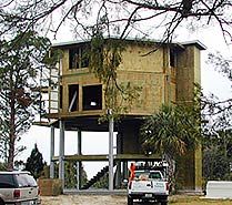 Florida beach house on pilings elevated 20 feet above ground to be safe from storm surge and flooding.