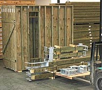 Hurricane-resistant prefab building components such as galvanized steel couplings, plywood and treated lumber.