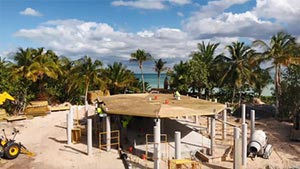 Prefab elevated home being built on a tropical island