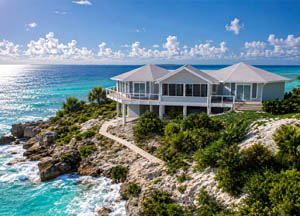 Topsider luxury coastal prefab home overlooking turquoise water in the Bahamas