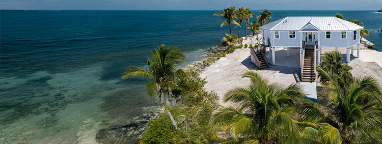 Elevated one-story stilt home in the Florida Keys, built on concrete pilings for hurricane and flood resistance