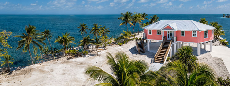 Elevated coastal piling home on the water in the Florida Keys, individually designed and engineered by Topsider Homes