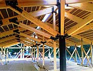 Steel columns and heavy timber "knee braces" add support for heavy snow and wind-loads.