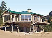 The completed post and beam pedestal house will withstand hurricanes and earthquakes.