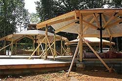 Topsider post and beam home frame being erected on site